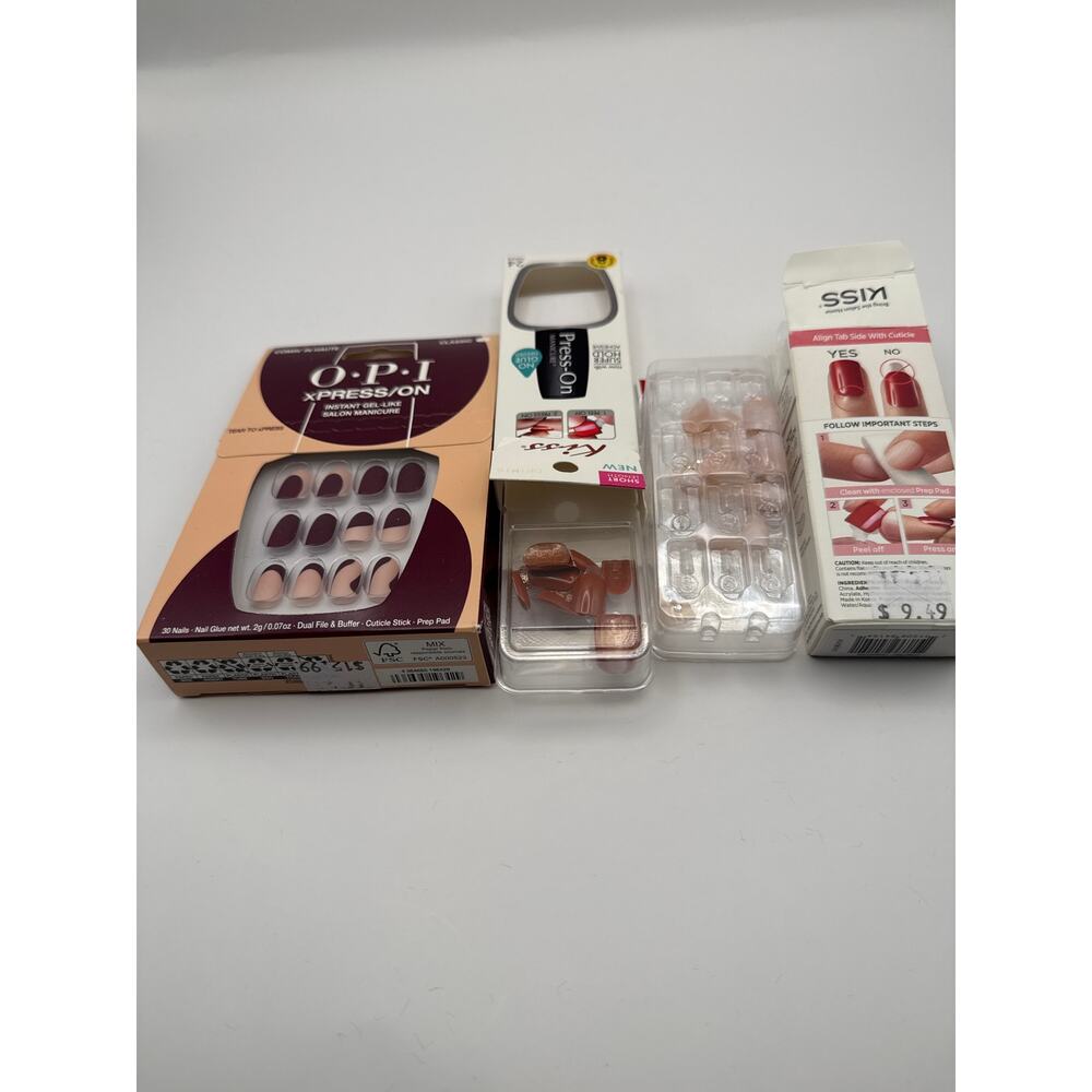 3 boxes of press on nails. One full new set and two incomplete sets